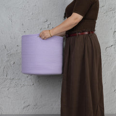 XUANGUO cotton rope basket blanket-bin keeps spaces tidy and cozy in living areas.