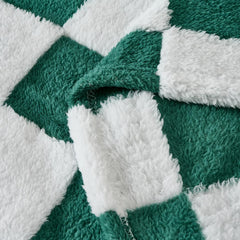 Yagle Mate fleece baby blanket in nursery decor tone enhances crib aesthetics with playful pattern.