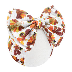 YanJie 7-Inch headband on baby with festive turkey bow for holiday outfits