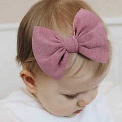 YanJie blue knotted bow headband offers gentle stretch for growing toddlers