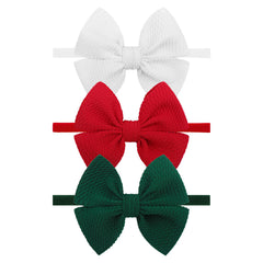 YanJie Christmas bows headband in red on newborn for festive photo sessions