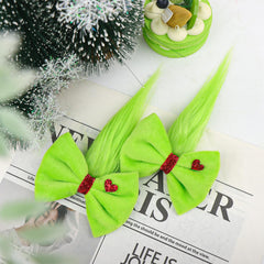YanJie Christmas hair bow worn on a girl adds cute seasonal style for party photos.