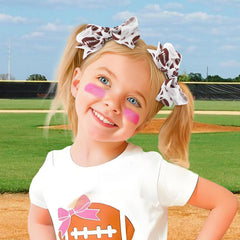YanJie football hair clip closeup showing glitter ribbon and bow detail