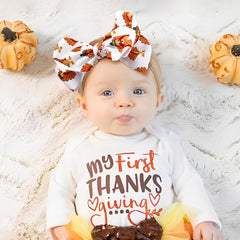 YanJie turkey-themed bows add a playful holiday accent to outfits.