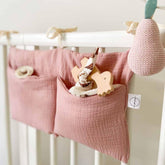 YeeMan cotton baby bedside hanging storage bag pink keeps diapers within reach.