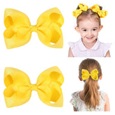 YHXX YLEN yellow hair bows on clips side view for everyday wear.