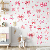Yinder Coquette pink bow decal collection on bedroom wall for a soft, inviting vibe.