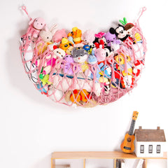 YKBU pink tassel hammock keeps toys organized and easy to access.