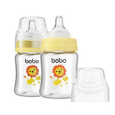 YOHKOH glass baby bottle close-up shows a smooth surface for easy cleaning.