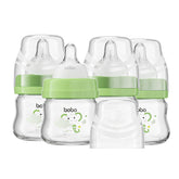 YOHKOH pack-of-4 glass baby bottles designed for easy cleaning and gentle newborn feeding.