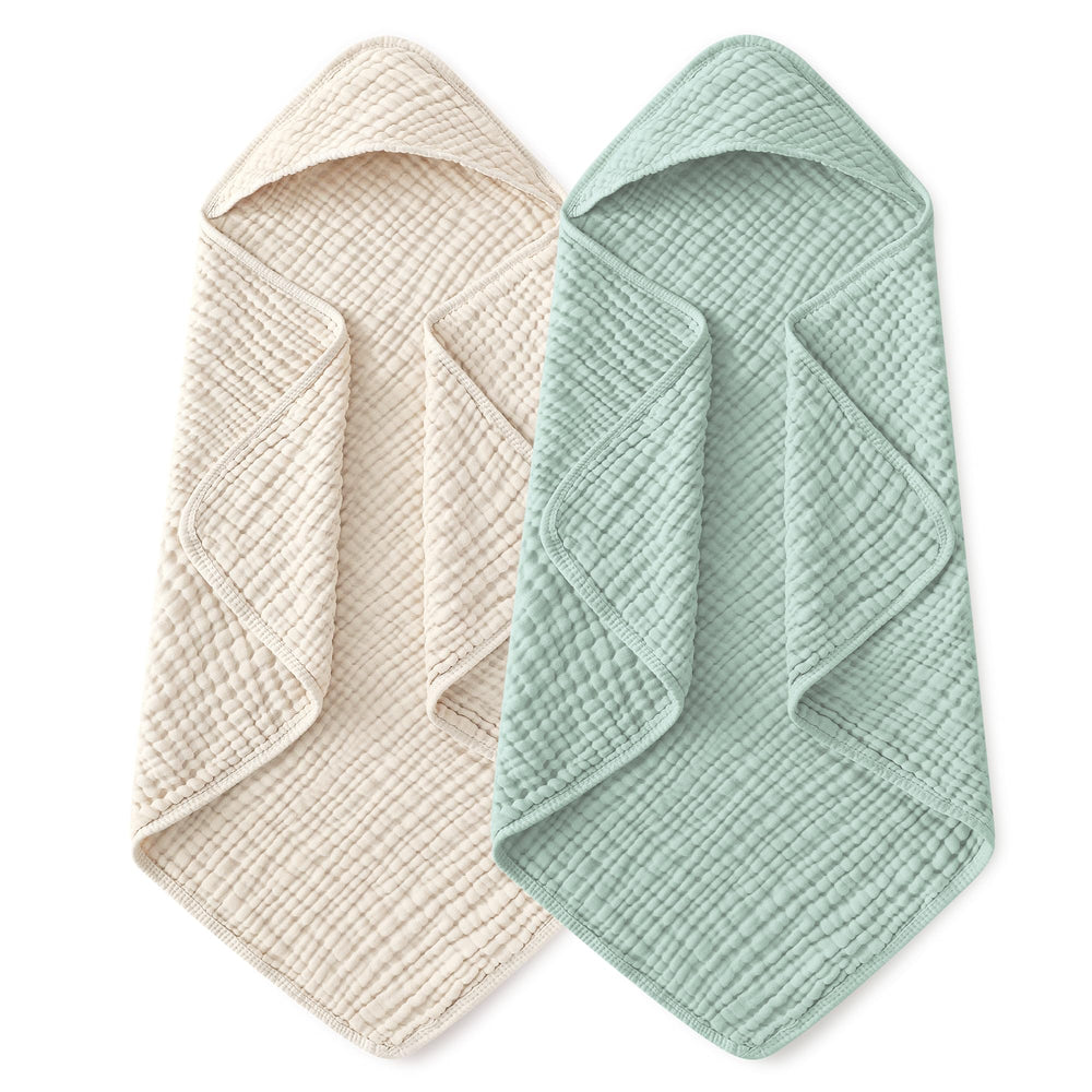 Yoofoss hooded baby towel folded in apricot-green, soft muslin ready for newborn bath