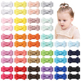 yoyokid mini bows closeup reveals snag-free gentle wear on delicate hair.