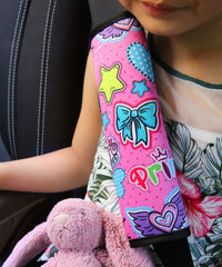 YR seat belt pad with pop pink cartoon pattern adds fun while reducing rubbing on rides.