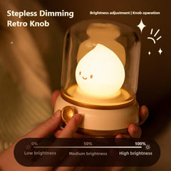 YumeGlint night light on wood desk provides warm, steady glow for reading.