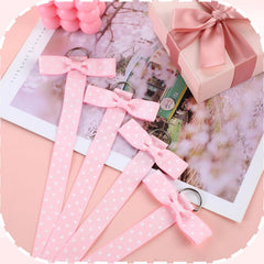 Yuomeaz hanging bow organizer on wall provides tidy, visible storage.