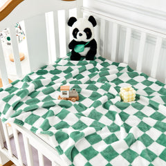 Yurhap checkered baby blanket crib scene highlights versatile swaddling and naps.