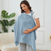 Zdolmy Muslin Nursing Cover in light blue folded for quick privacy on the go.