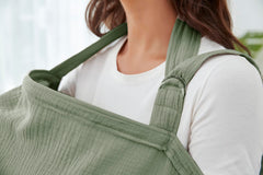 Zdolmy Muslin Nursing Cover worn around the neck provides breathable coverage.