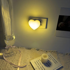 ZEZHOU Heart Night Light plugged into wall for gentle ambient glow in a kids' room
