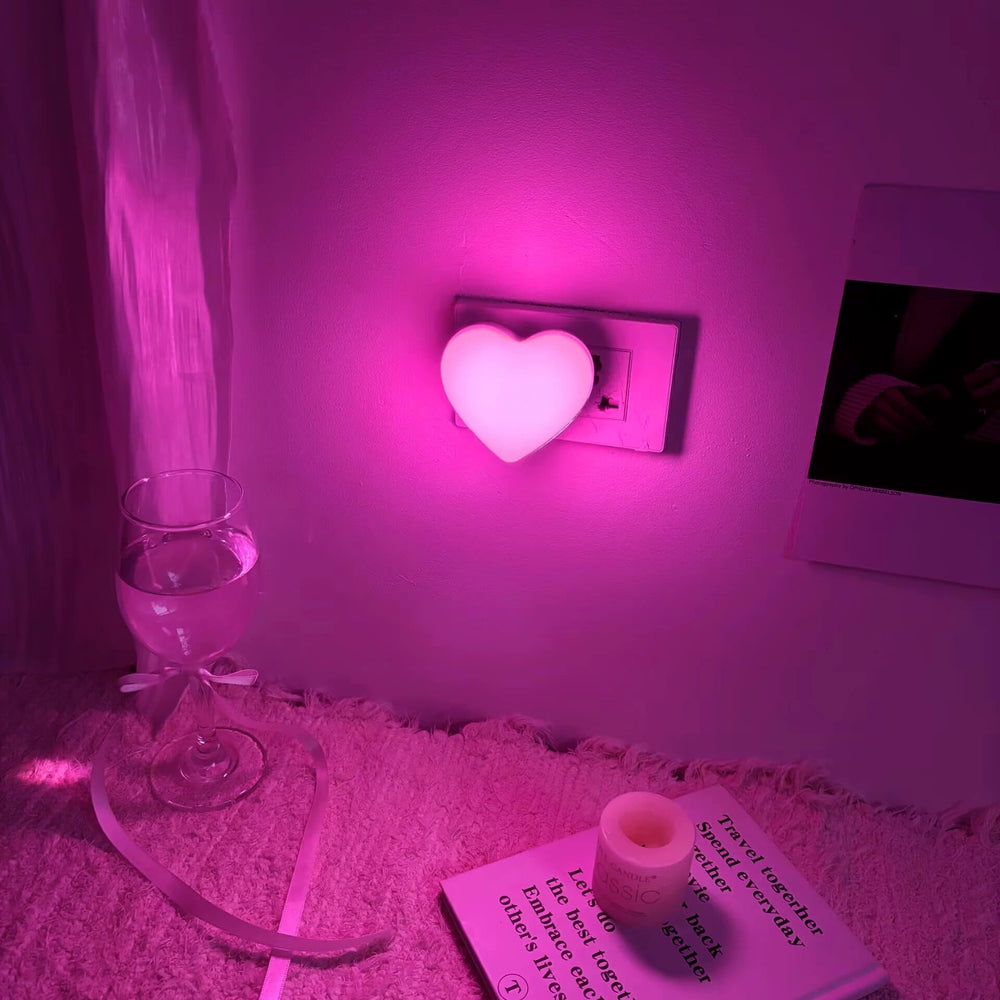 ZEZHOU Heart Night Light plugs into wall with gentle glow for safe nighttime navigation.