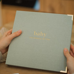 ZICOTO keepsake baby memory book back pocket holds small keepsakes like drawings.