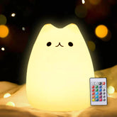 ZKLiLi cute remote cat night light on desk provides a warm bedtime glow.