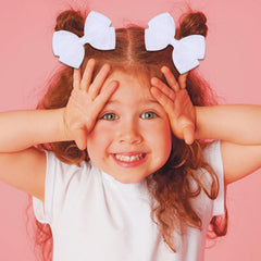 Zolyco white glitter organza bow clip side view showing secure alligator clip