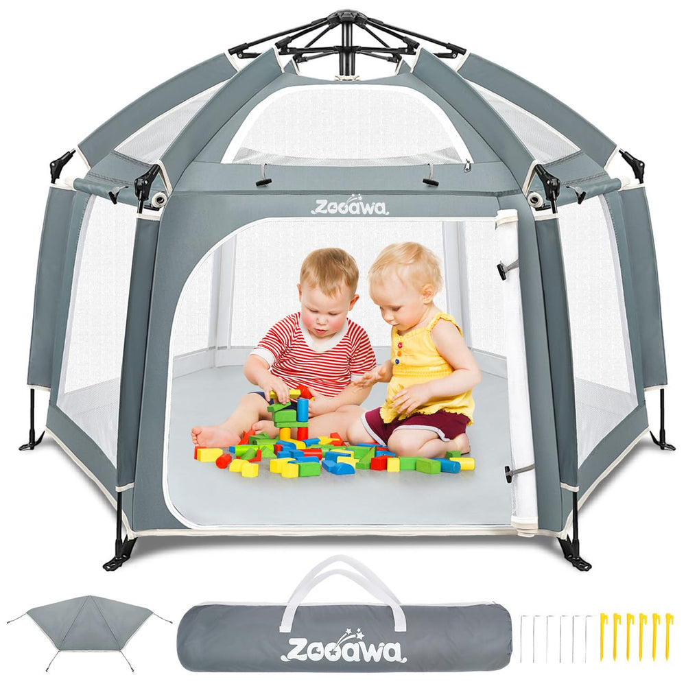 Zooawa pop up playpen on the beach providing a safe outdoor play space
