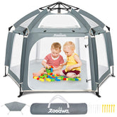 Zooawa pop up playpen on the beach providing a safe outdoor play space