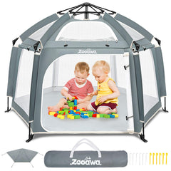 Zooawa pop up playpen on the beach providing a safe outdoor play space