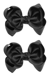 ZOONAI 3-inch black glitter bow clip worn in a photo-ready look for baby girls