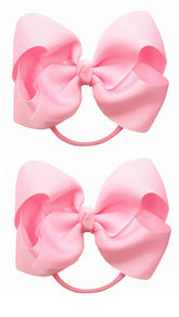 ZOONAI 4-inch baby bow pink close-up on elastic hair tie for secure ponytails.