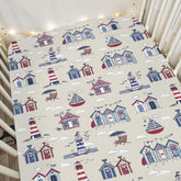 ZoUbqchY Beach Huts Lighthouse crib sheets on standard crib, cozy sleep setup