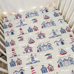 ZoUbqchY Beach Huts Lighthouse crib sheets on standard crib, cozy sleep setup