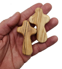 Zuluf two small olive wood crosses held for prayer and reflection
