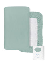 ZURLEFY light-blue bassinet sheet closeup reveals soft muslin fabric for gentle sleep.