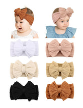 ZURLEFY rust baby headband bow on baby with soft stretchy comfort.