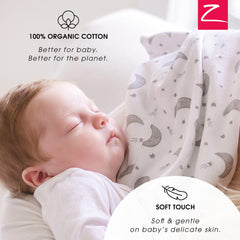 Zutano Dino Party burp cloth rolled for compact travel-friendly storage.
