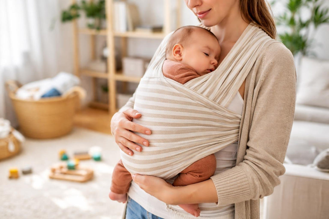 Parent wearing baby in a snug, safe front carry