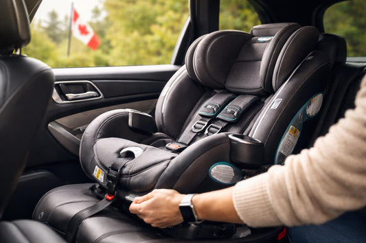 Parent installing car seat securely in a Canadian vehicle