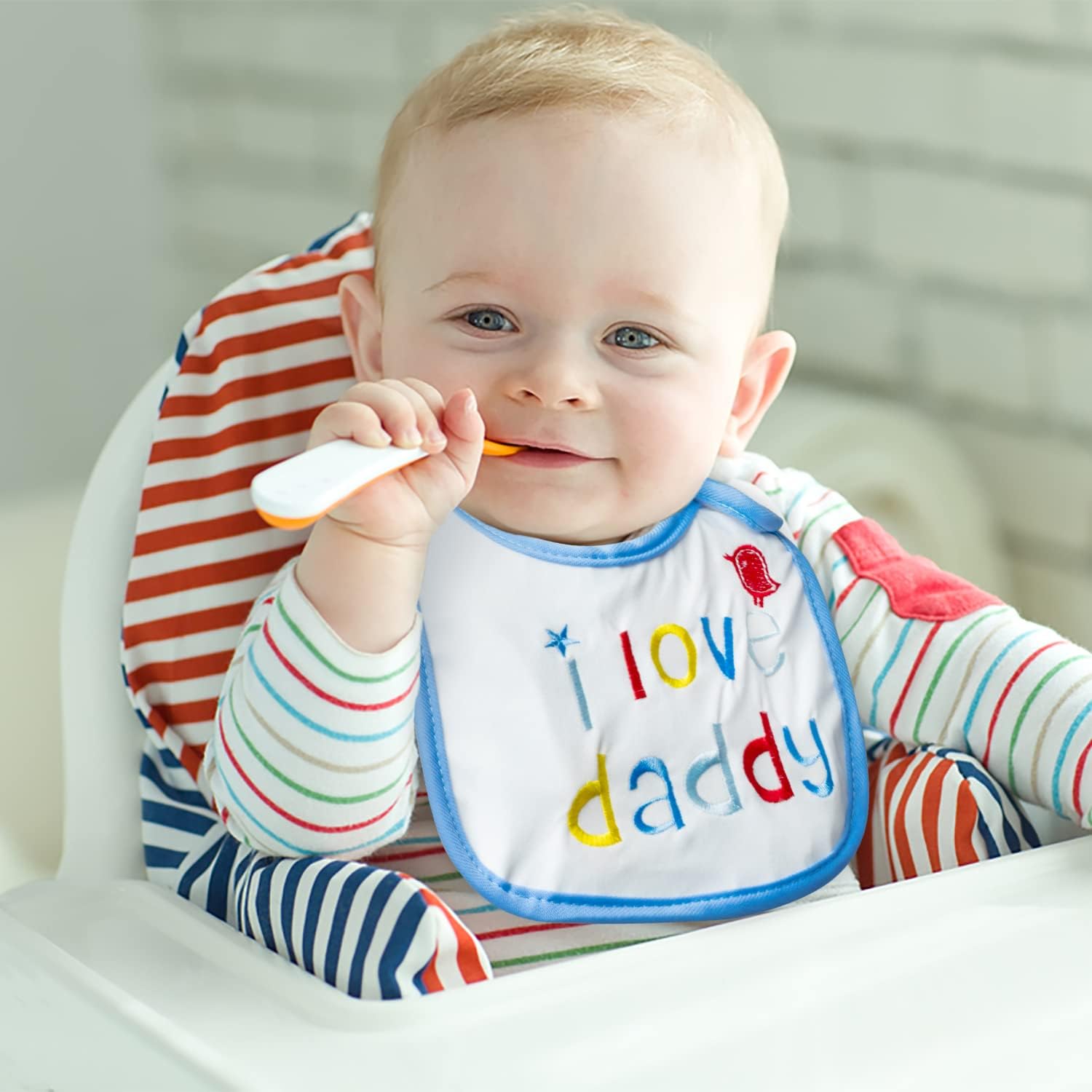 2ooya baby bib dinosaur pattern keeps clothes dry while eating.