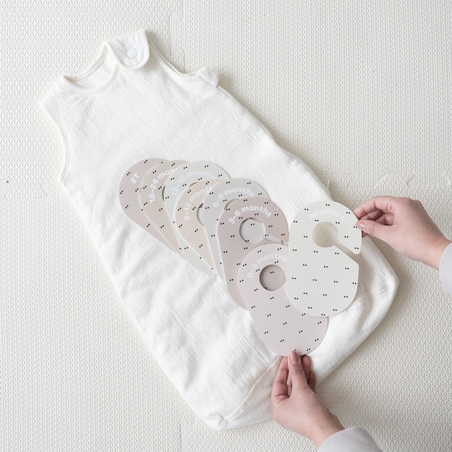 3 Sprouts closet dividers 2T labels aid future outfit planning.