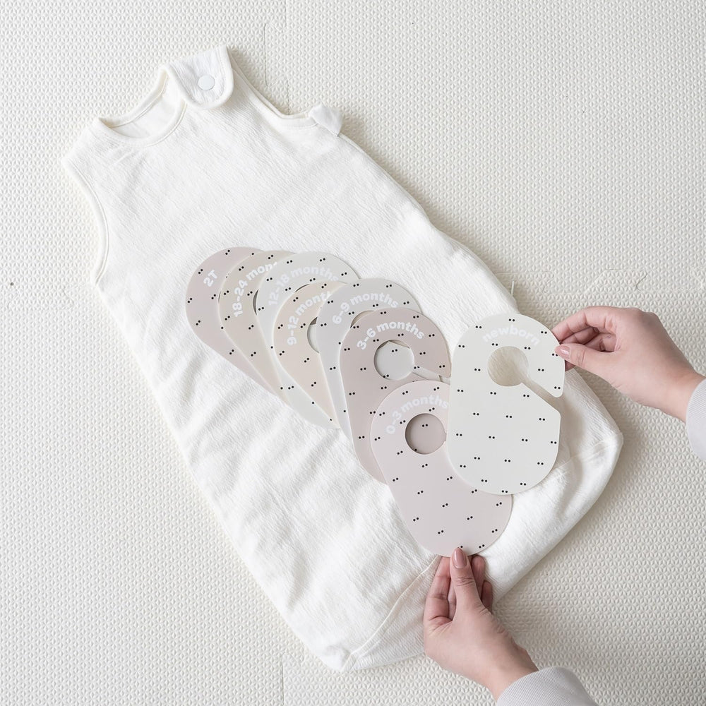 3 Sprouts closet dividers 2T labels aid future outfit planning.