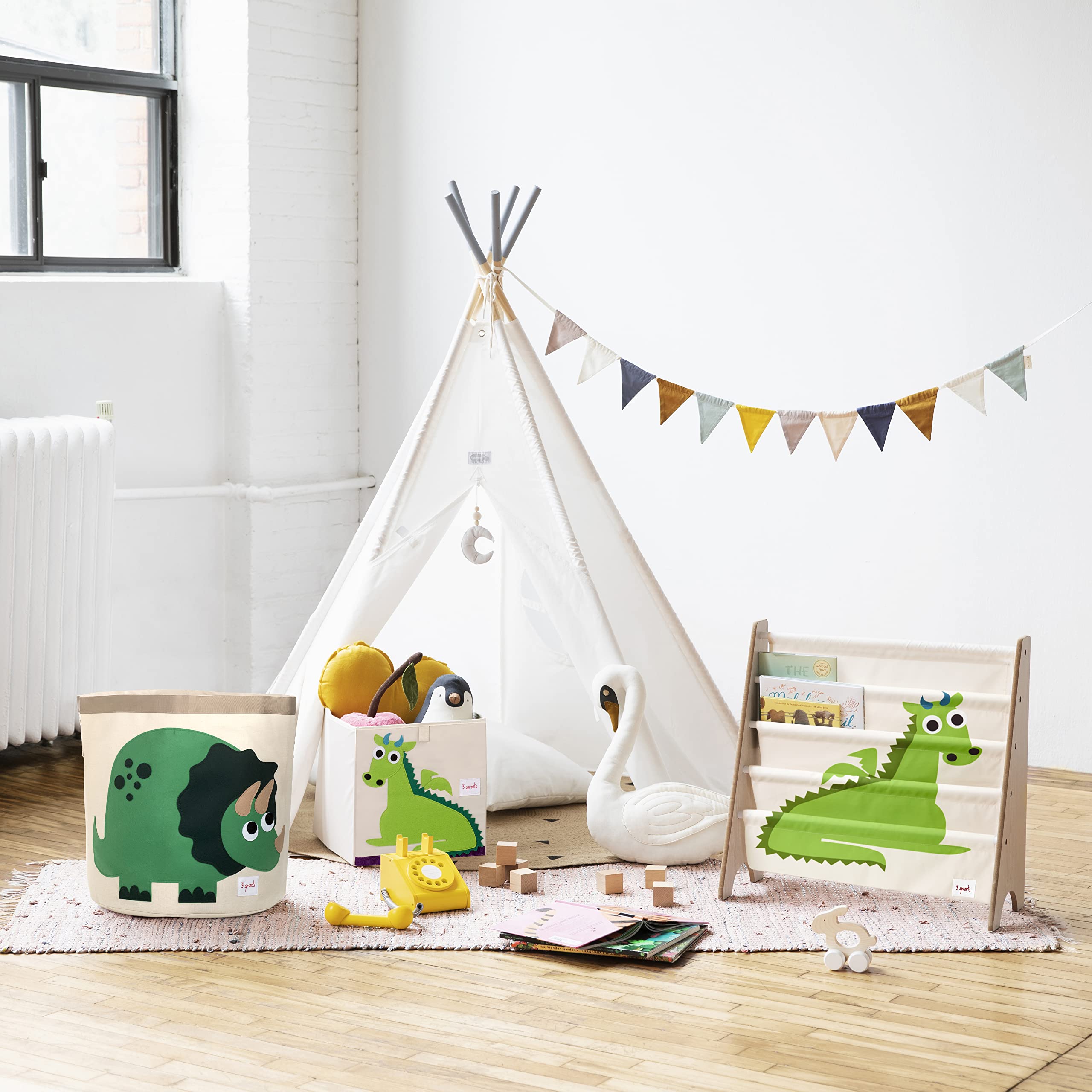 3 Sprouts foldable toy bin in playroom for space-saving organization.