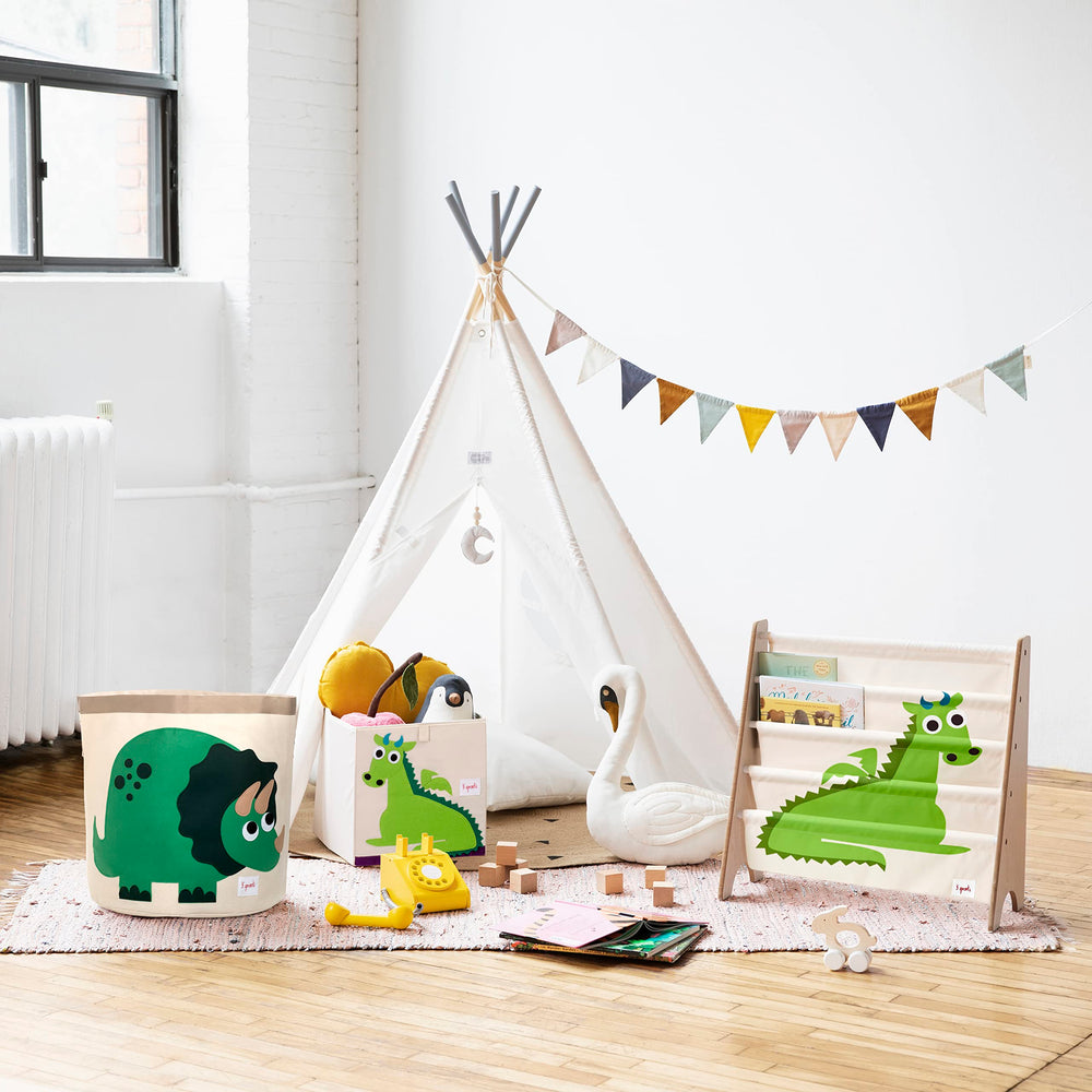 3 Sprouts foldable toy bin in playroom for space-saving organization.
