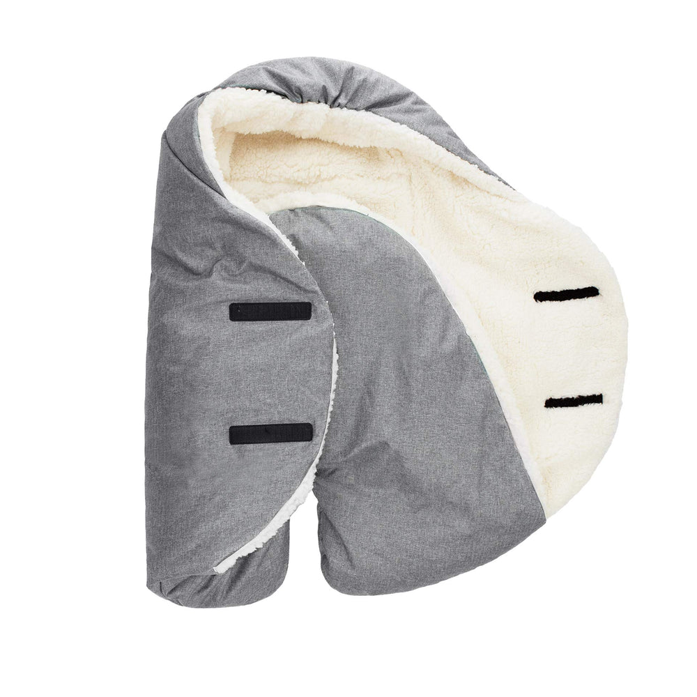 7 A.M. blanket with adjustable wrap supports growing babies for secure fit.