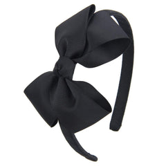 7Rainbows black bow headband closeup featuring eco-friendly grosgrain ribbon