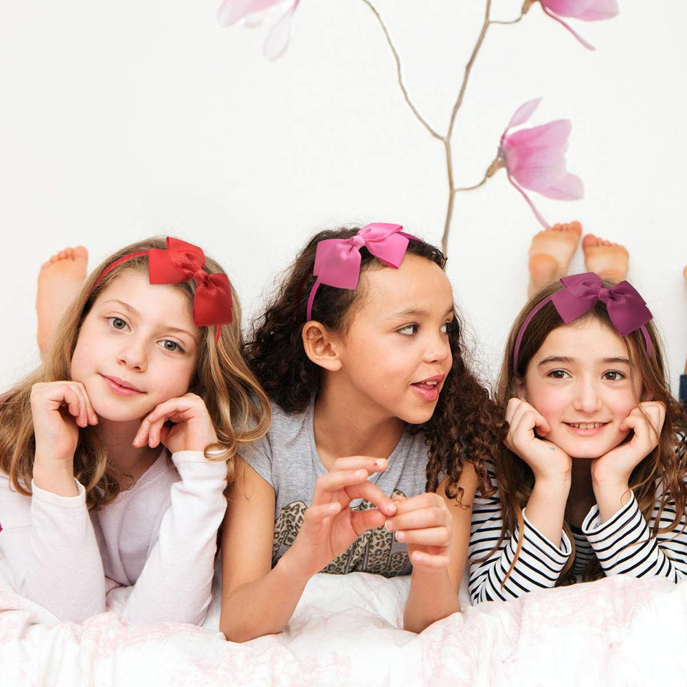 7Rainbows red bow headband pairs with school uniforms and casual wear