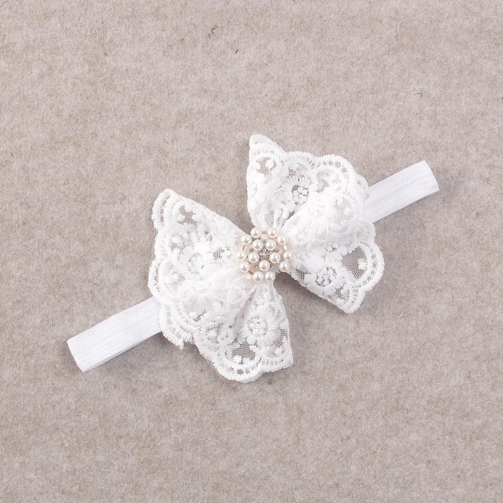 Nishine lace headband closeup showing secure fit elastic