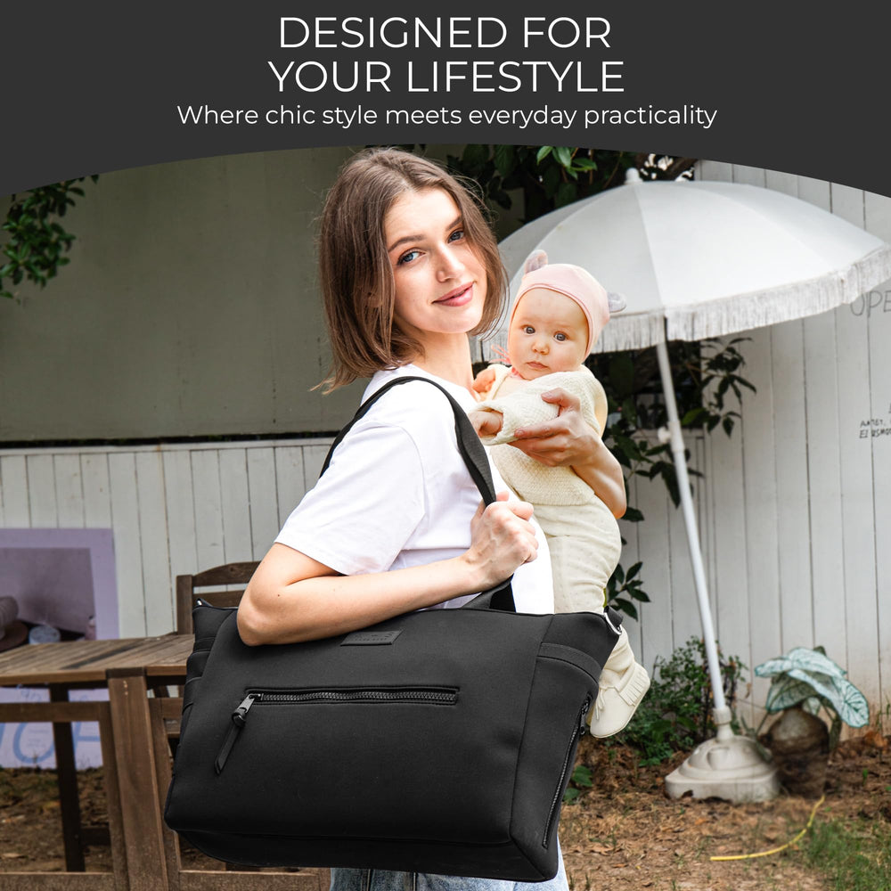 A + S Luxxe Diaper Bag Tote showcases gold hardware for a luxury handbag look.